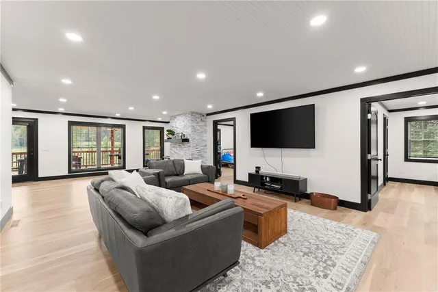a view of a living room kitchen with furniture and a refrigerator