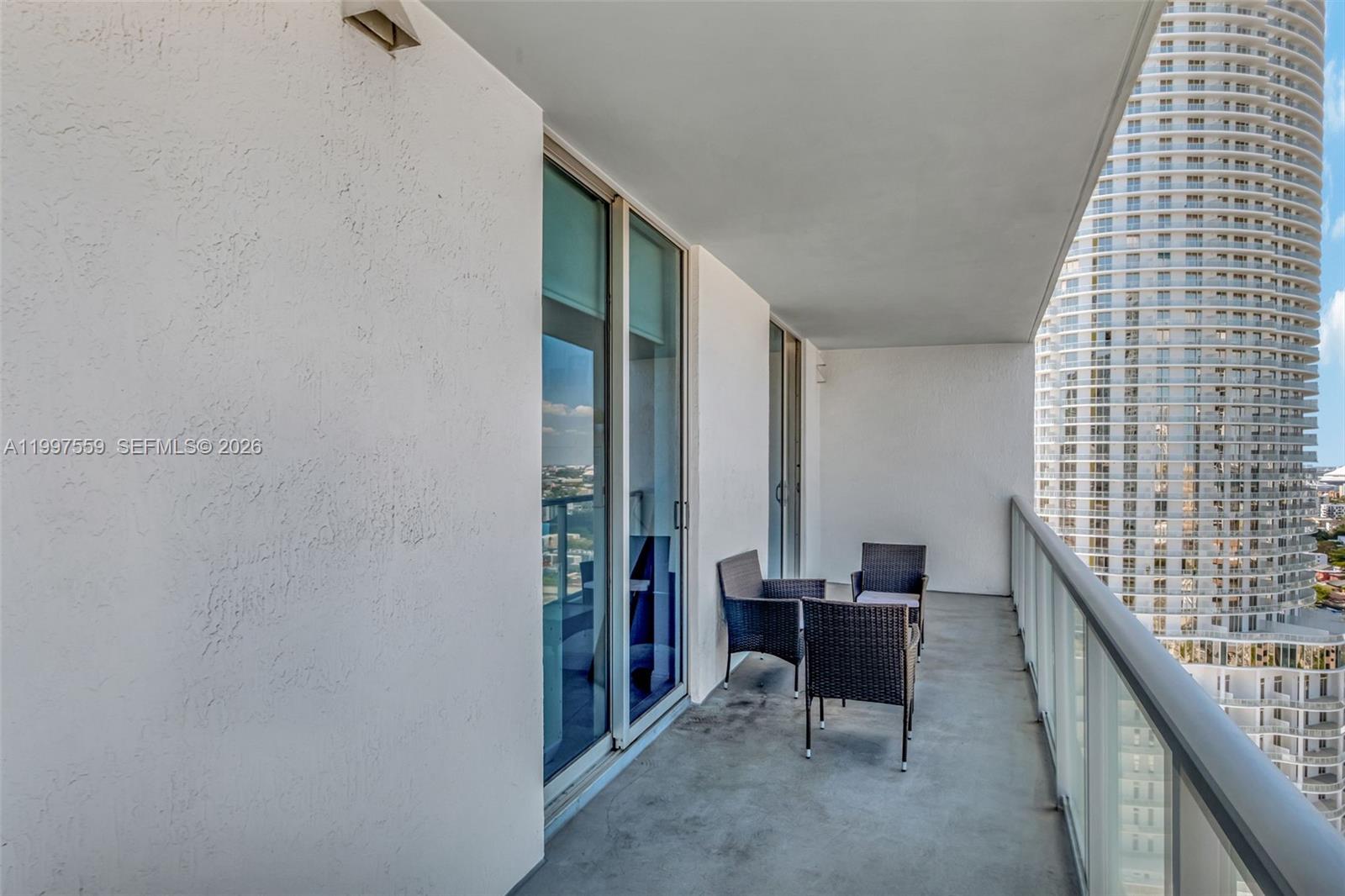 185 Southwest 7th Street, Unit 2303 Miami, FL 33130 - Photo 10 of 40 a view of a balcony with furniture