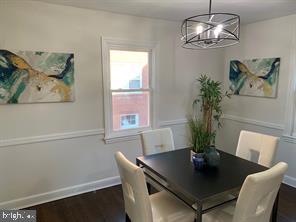 9407 Colesville Road, Unit B Silver Spring, MD 20901 - Photo 11 of 48 Modern dining space with artistic flair.