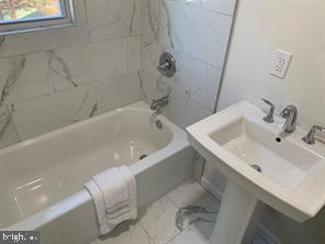 9407 Colesville Road, Unit B Silver Spring, MD 20901 - Photo 24 of 48 Modern bathroom with elegant marble accents.