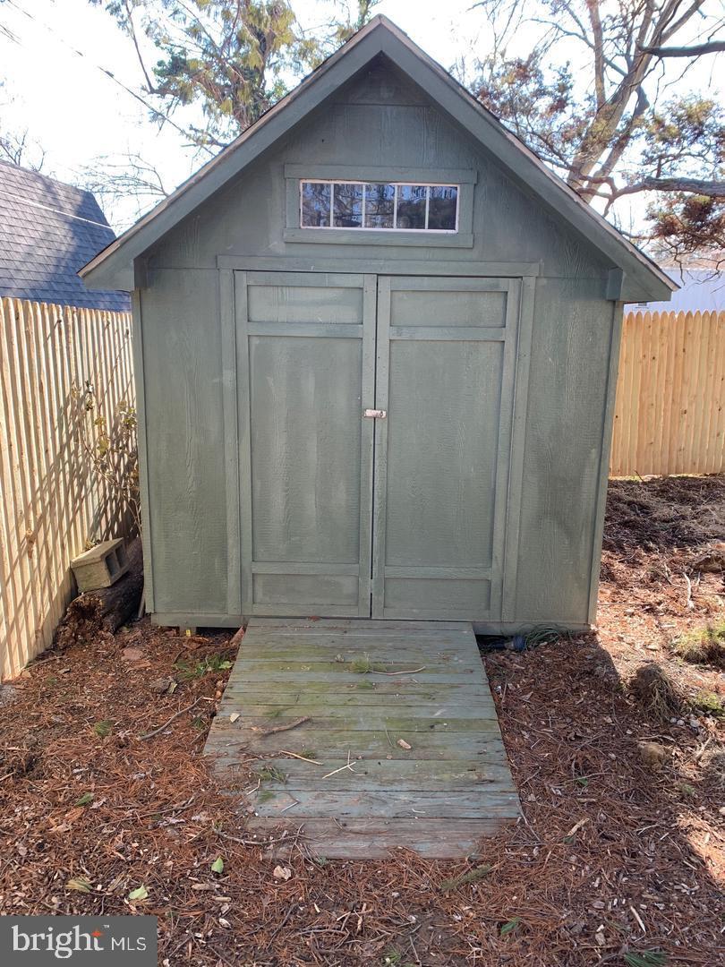 9407 Colesville Road, Unit B Silver Spring, MD 20901 - Photo 41 of 48 Charming garden shed with rustic appeal.