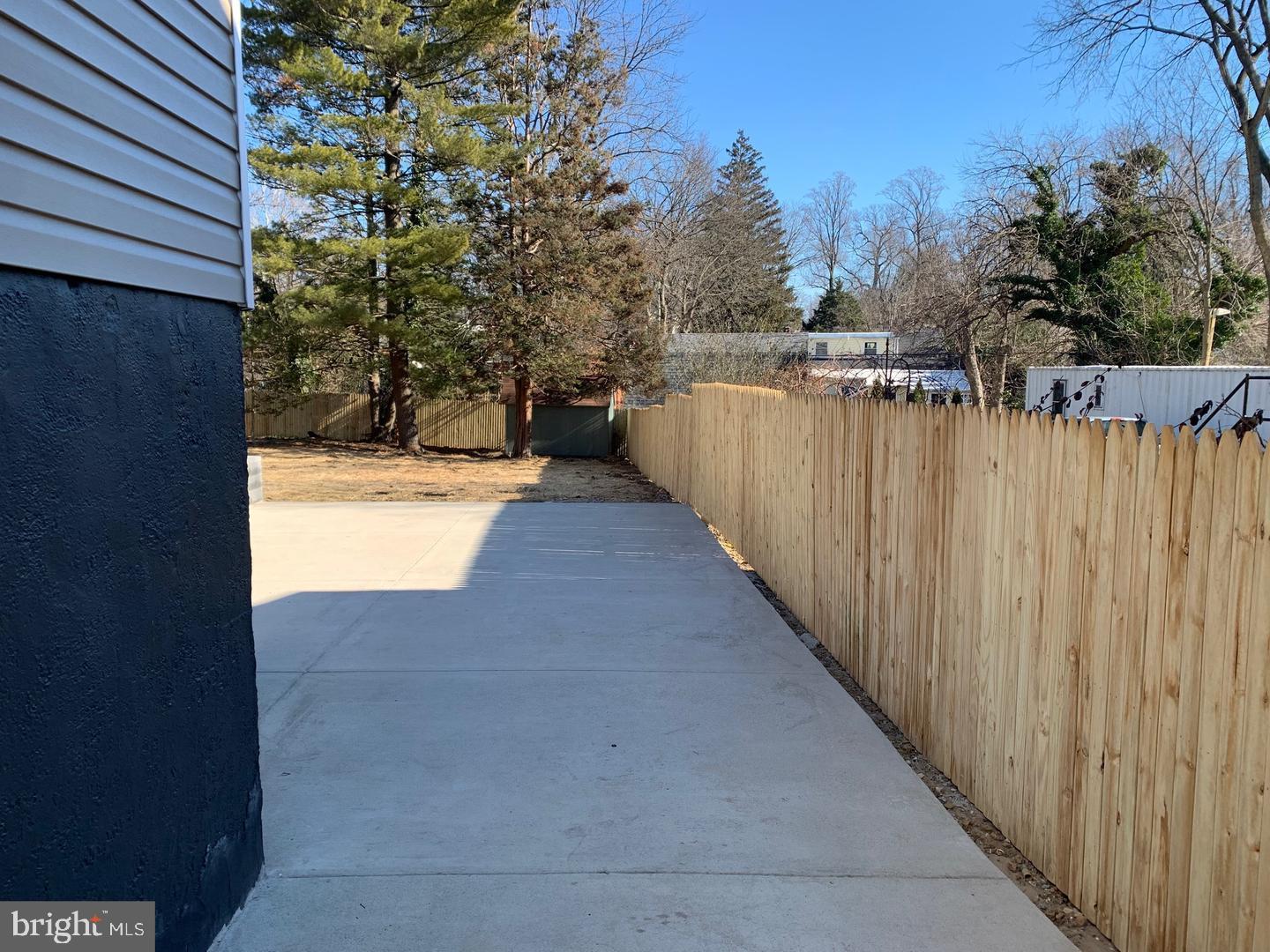 9407 Colesville Road, Unit B Silver Spring, MD 20901 - Photo 45 of 48 Serene outdoor space with wooden fencing.