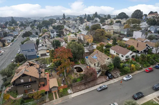 an aerial view of residential houses with outdoor space