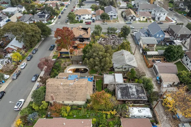 an aerial view of residential houses with outdoor space