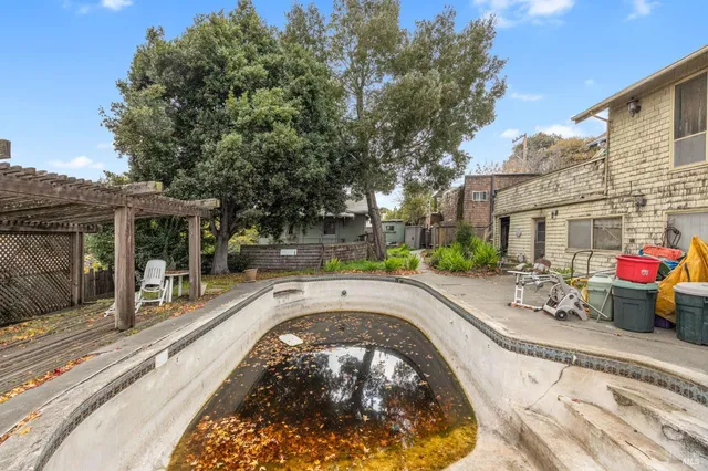 a view of a swimming pool with a patio