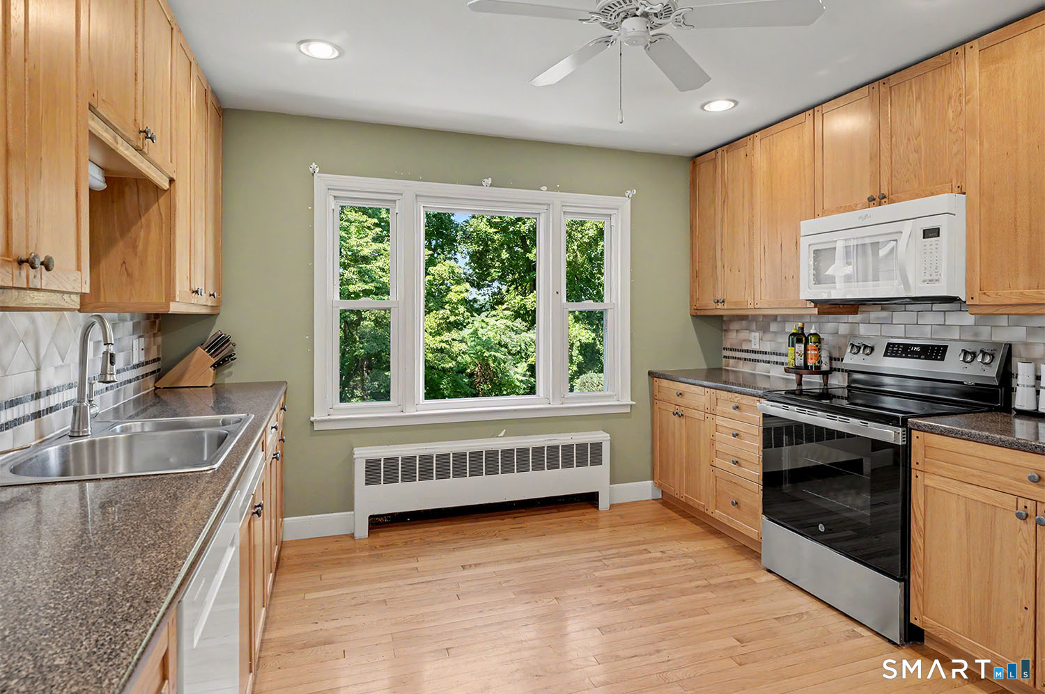 365 Adley Road Fairfield, CT 06825 - Photo 12 of 39 Kitchen with hardwood floors accommodates small table and chairs or kitchen island