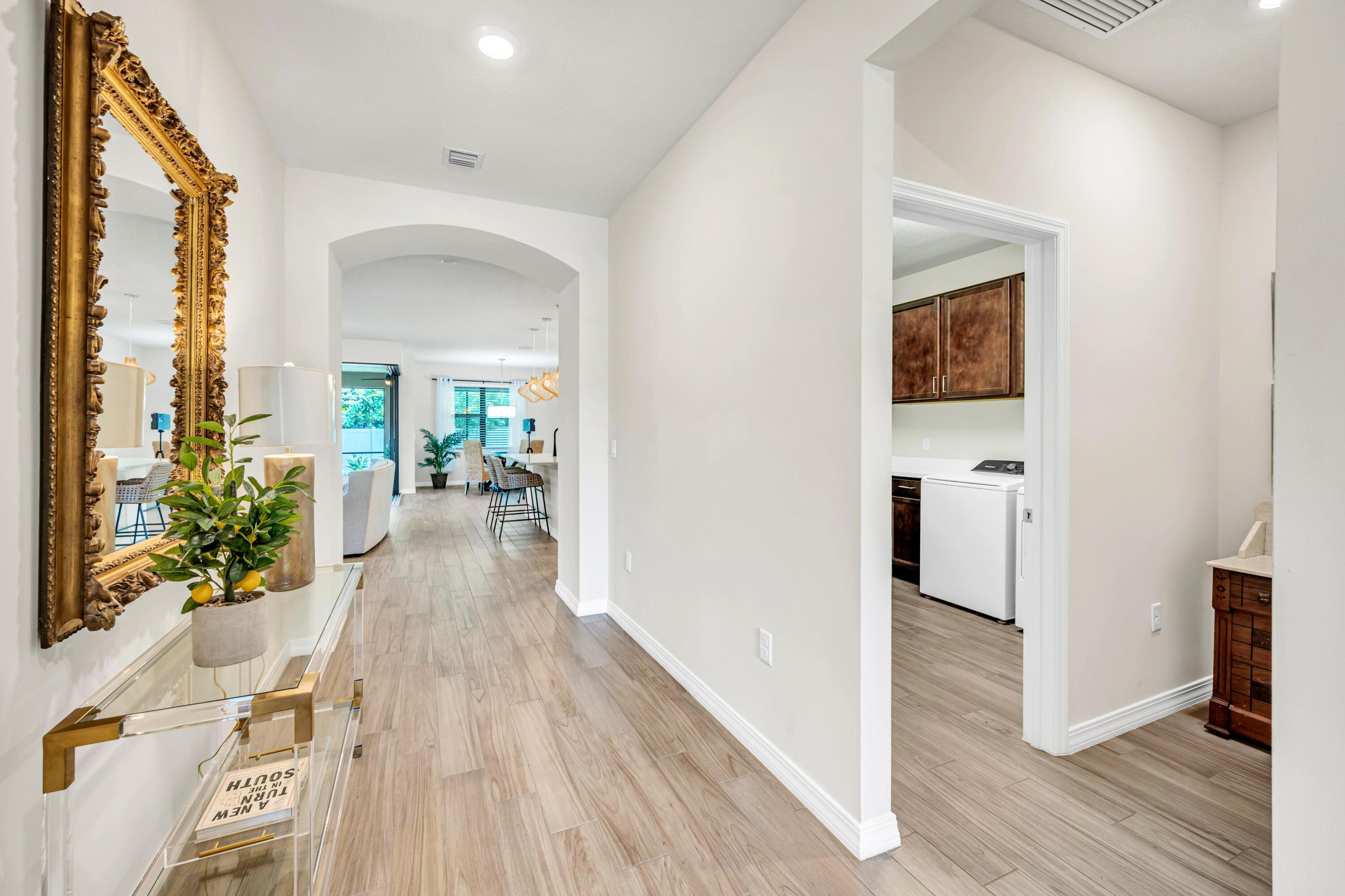 8028 Northwest 78th Street Tamarac, FL 33321 - Photo 25 of 38 a view of a hallway view with wooden floor and staircase