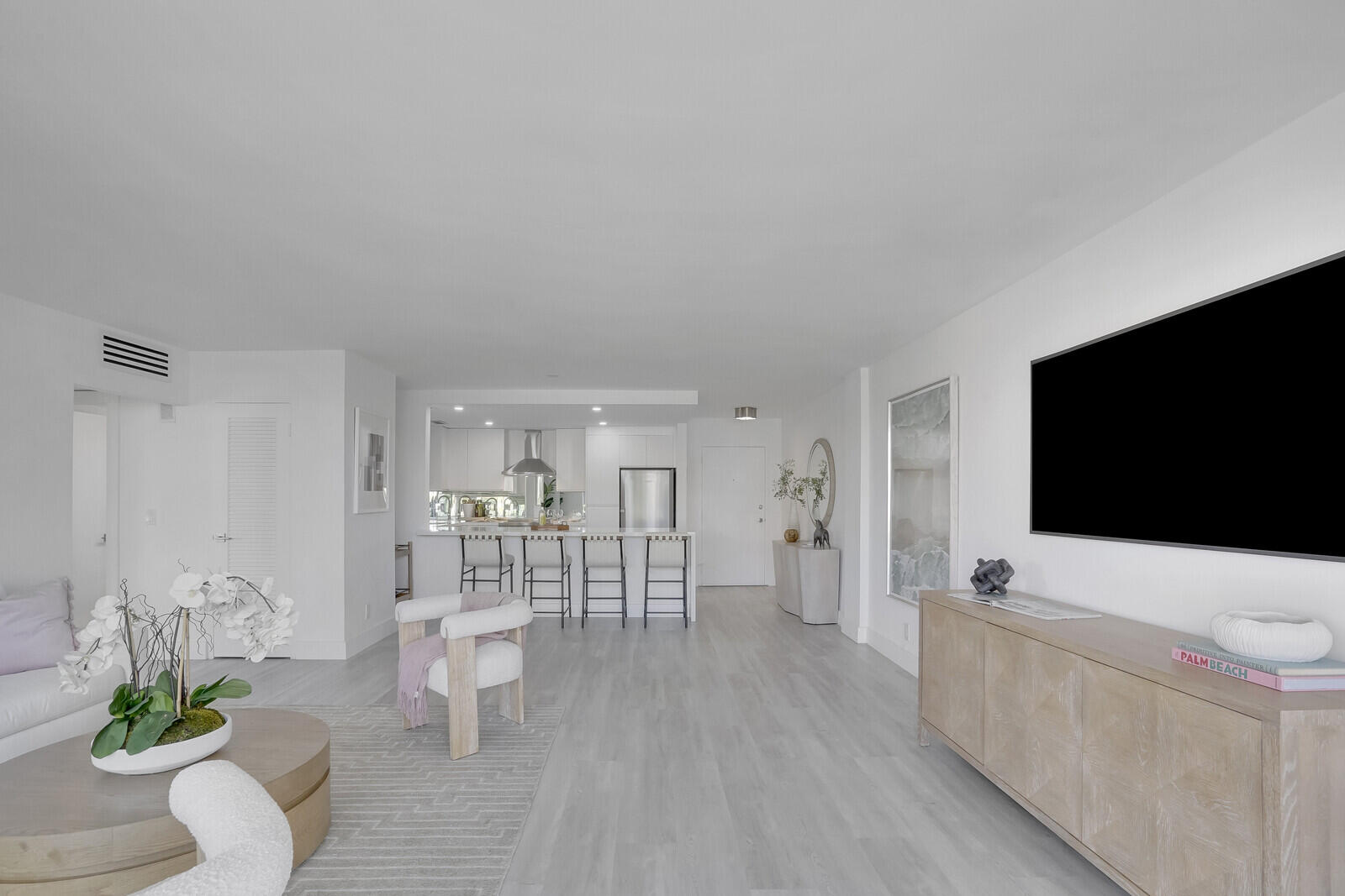 354 Chilean Avenue, Unit 4D Palm Beach, FL 33480 - Photo 15 of 23 a living room with furniture and a flat screen tv