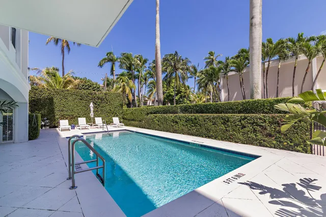 a view of a chairs and table in patio