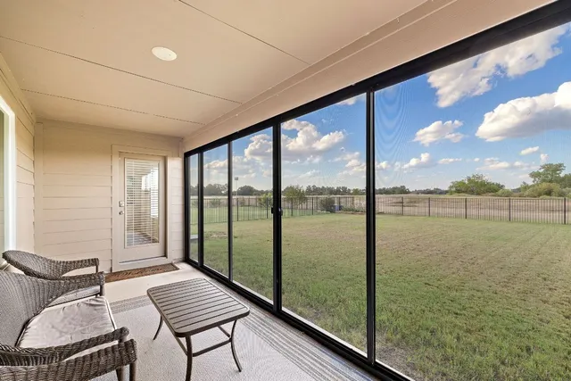 a balcony with chairs