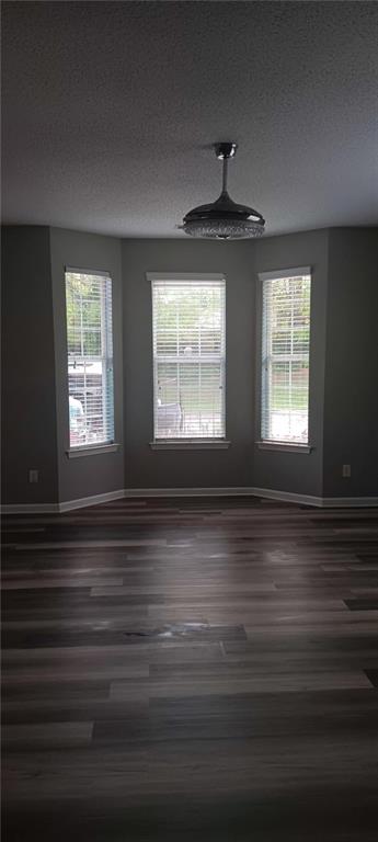 2324 Coach Way Jonesboro, GA 30236 - Photo 15 of 15 a view of an empty room with wooden floor and a window