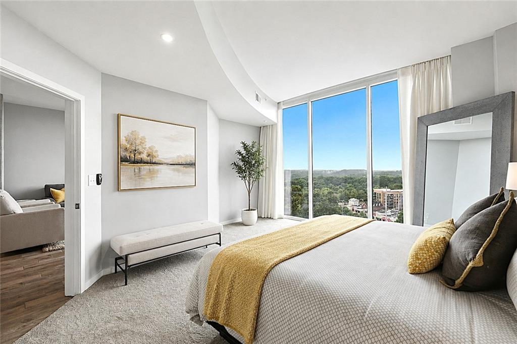 3300 Windy Ridge Parkway Southeast, Unit 1112 Atlanta, GA 30339 - Photo 20 of 43 a bedroom with a bed and a large window