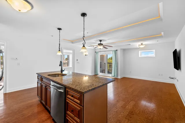a view of kitchen with refrigerator and window