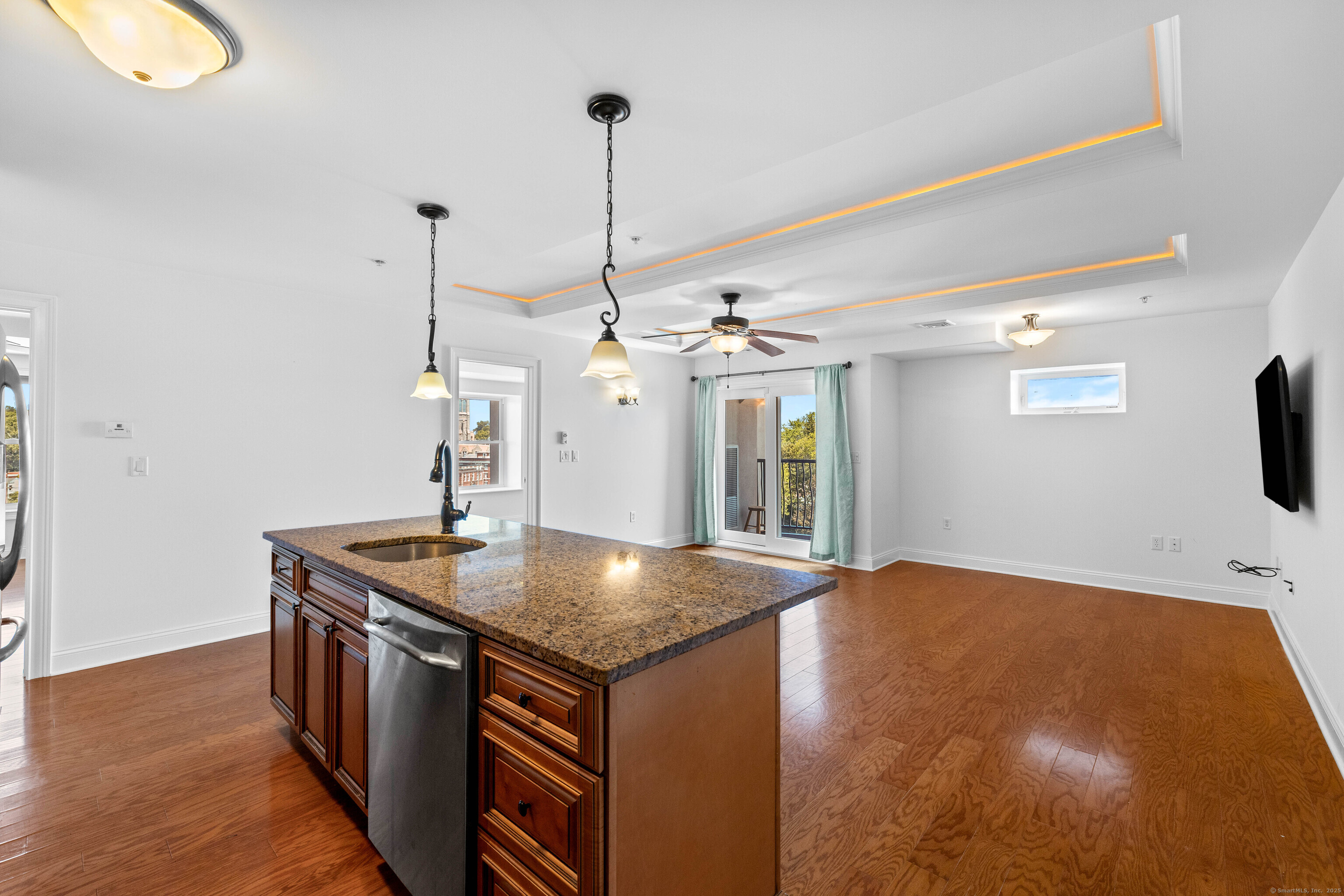 461 Bank Street, Unit 802 New London, CT 06320 - Photo 12 of 35 a kitchen with a sink a chandelier and wooden floor