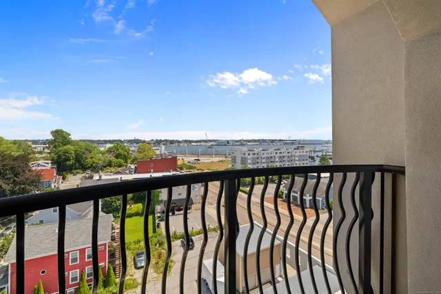 a view of a balcony with chairs