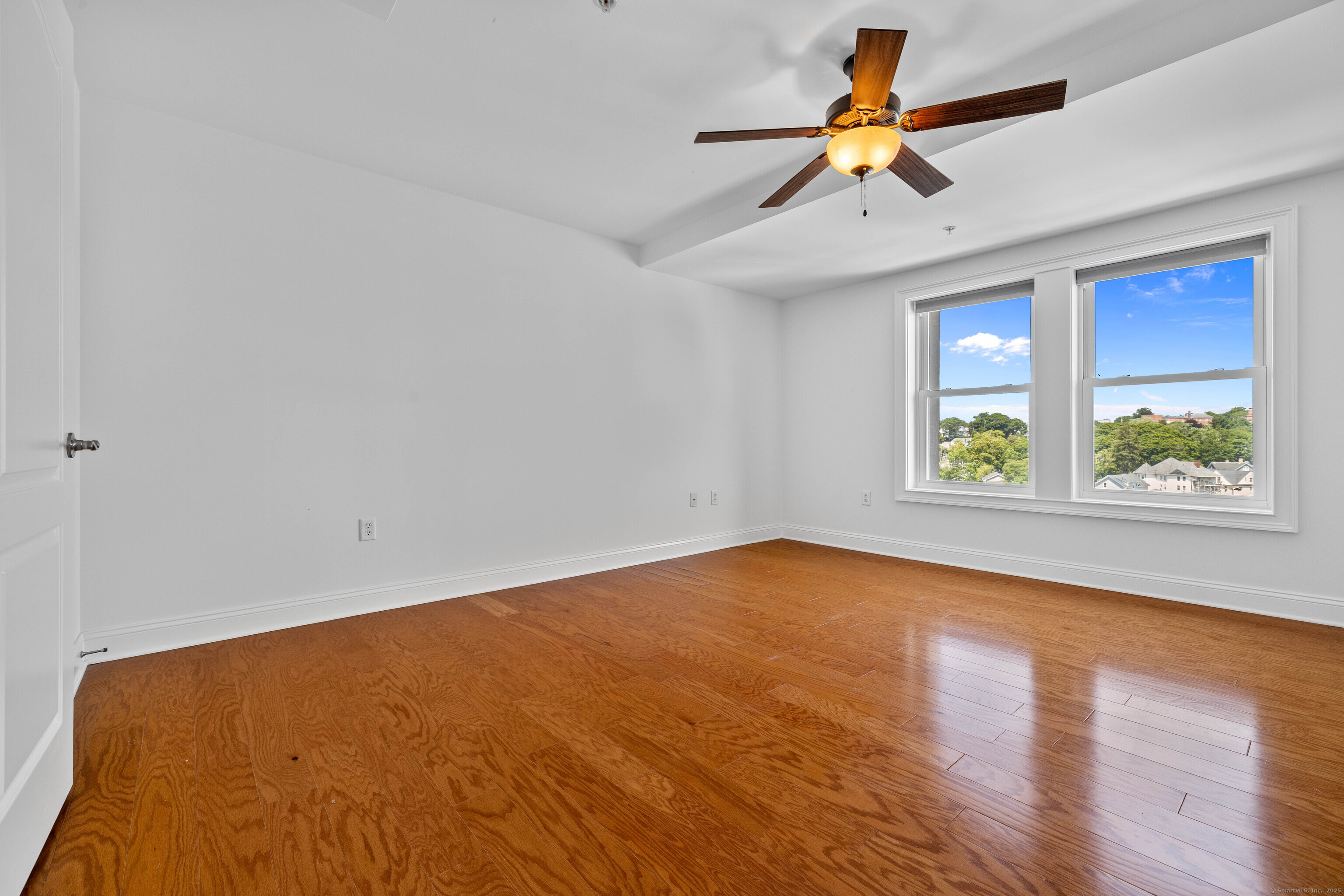 461 Bank Street, Unit 802 New London, CT 06320 - Photo 17 of 35 wooden floor in an empty room with a window