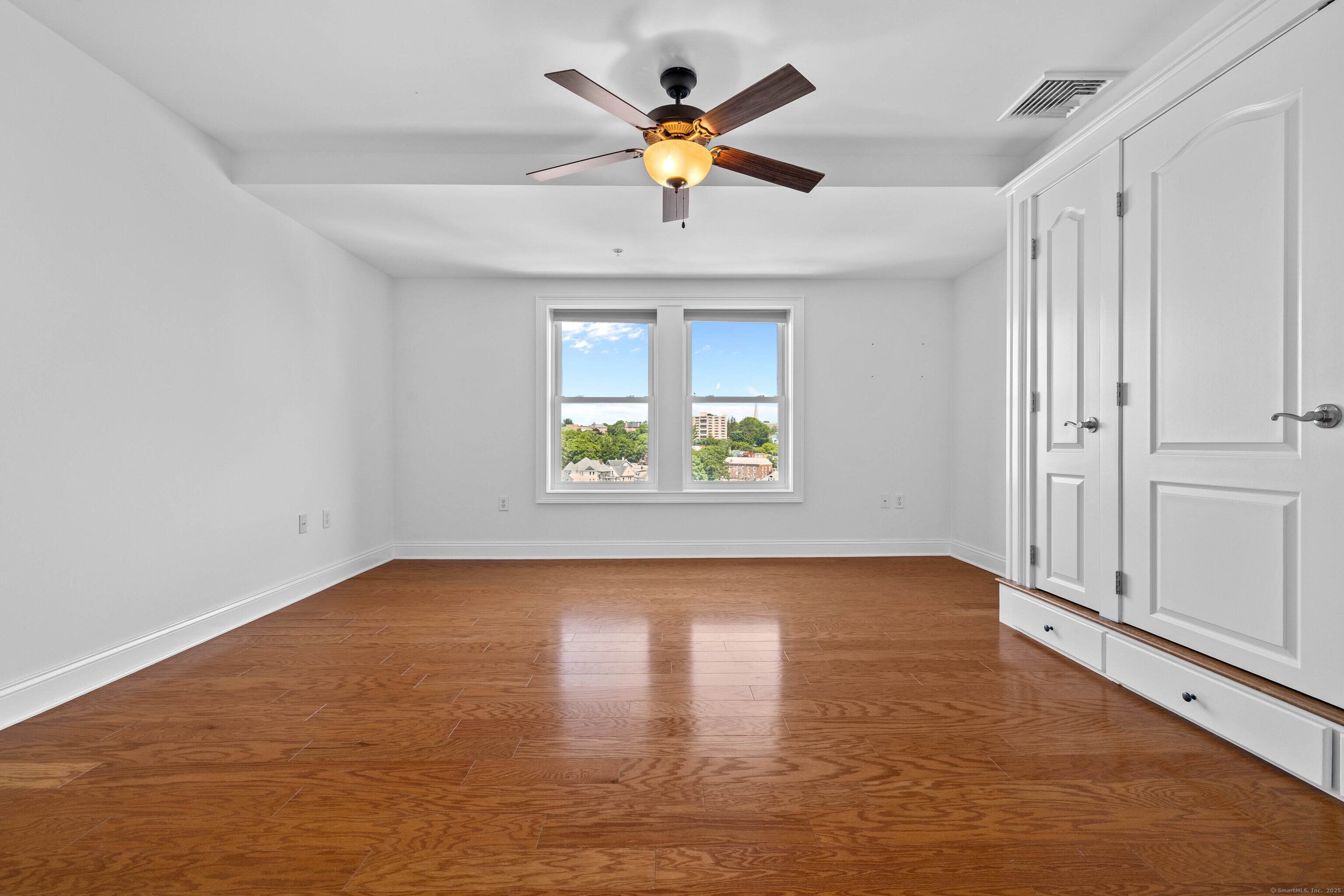 461 Bank Street, Unit 802 New London, CT 06320 - Photo 23 of 35 wooden floor in an empty room with a window