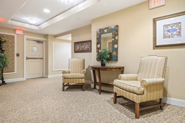 a spacious bedroom with a large bed and a large window