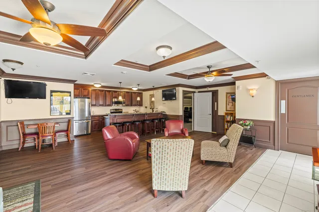 a view of a livingroom with furniture and windows
