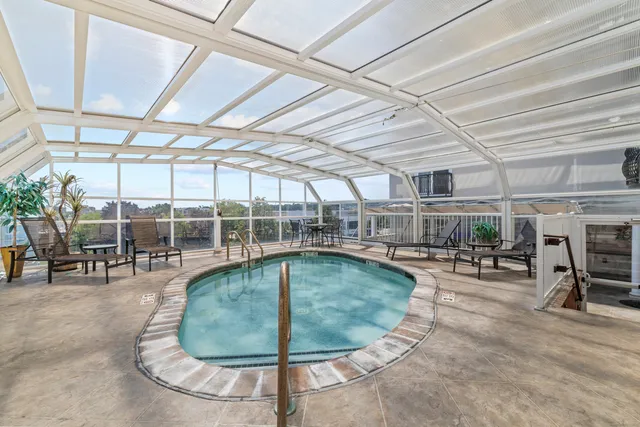 a view of a dinning table and chairs in patio