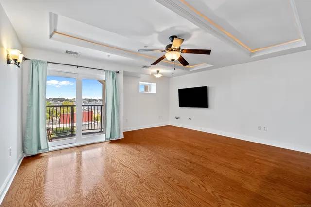 a view of a living room with a large window