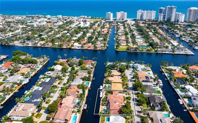 a view of a living room and kitchen with a large window