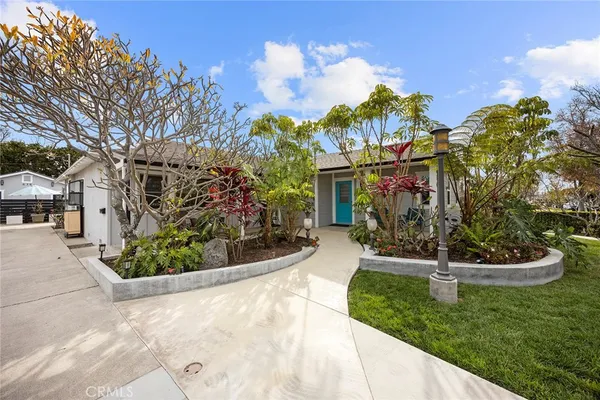 a living room with furniture large window and a fireplace