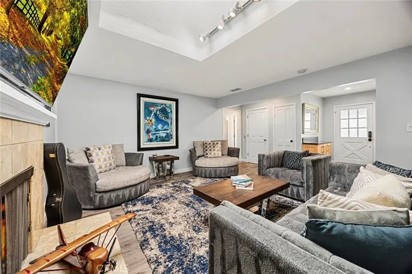 a kitchen with sink refrigerator dining table and chairs
