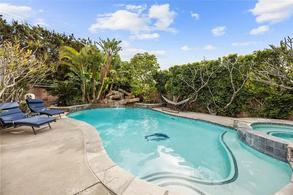 a large kitchen with stainless steel appliances granite countertop a large stove a sink dishwasher and a refrigerator