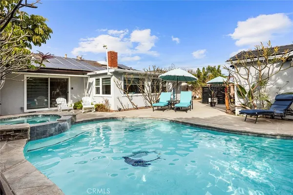 a kitchen with stainless steel appliances granite countertop a refrigerator a stove a sink and dishwasher