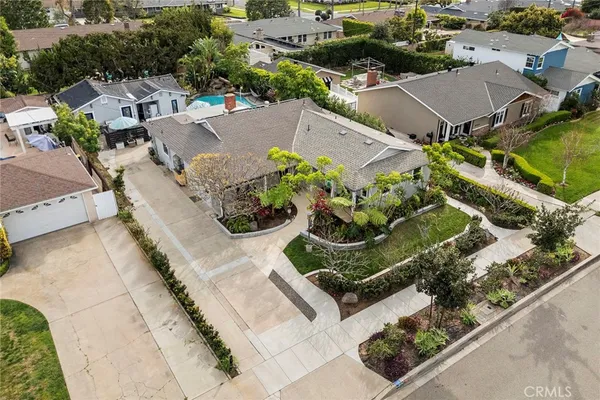 a view of a white house with a yard