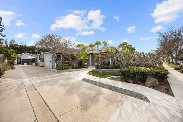 a view of a patio with table and chairs and potted plants