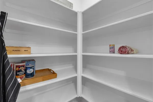 a kitchen with stainless steel appliances granite countertop a refrigerator stove and microwave