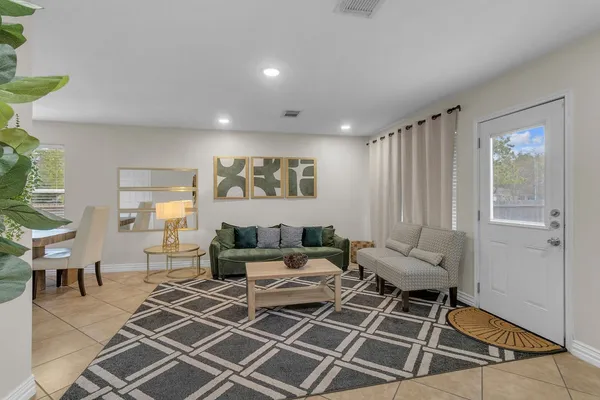 a living room with furniture and a window