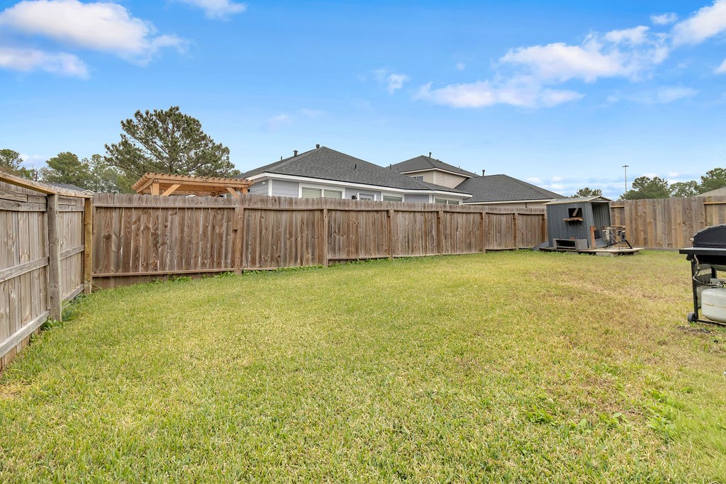 746 Cape Cottage Lane Spring, TX 77373 - Photo 35 of 36 a view of a yard with wooden fence