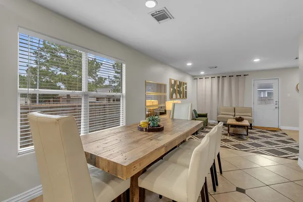 a view of a dining room with furniture window and outside view