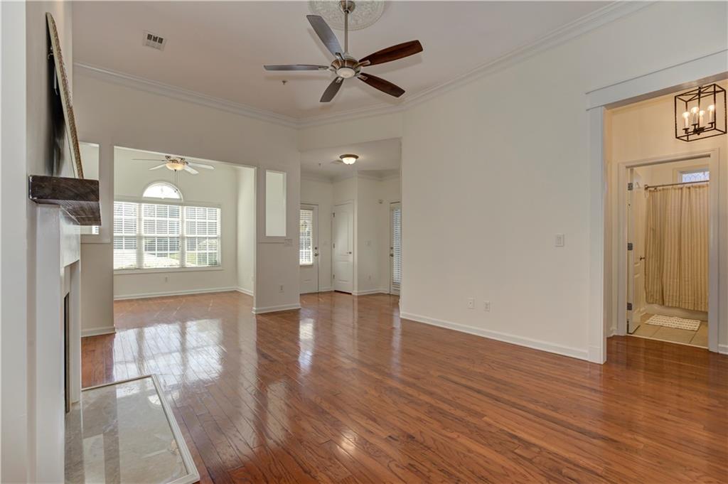 232 Glens Loop Woodstock, GA 30188 - Photo 16 of 52 a view of an empty room with wooden floor and a window