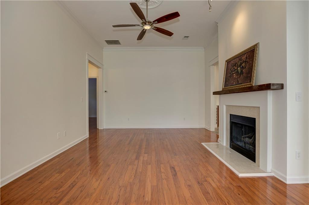 232 Glens Loop Woodstock, GA 30188 - Photo 17 of 52 a view of a livingroom with wooden floor a fireplace and a window