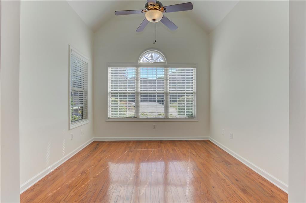 232 Glens Loop Woodstock, GA 30188 - Photo 20 of 52 wooden floor in an empty room with a window