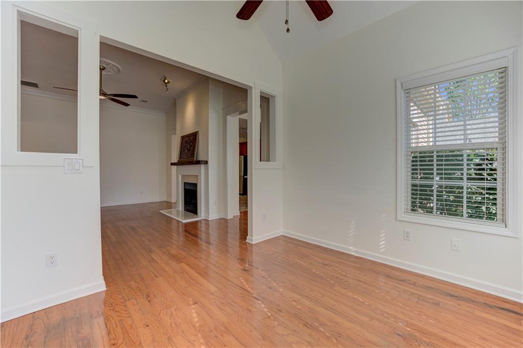 232 Glens Loop Woodstock, GA 30188 - Photo 21 of 52 a view of an empty room with wooden floor and a window