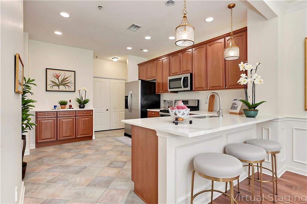 232 Glens Loop Woodstock, GA 30188 - Photo 22 of 52 a kitchen with kitchen island a sink counter and chairs