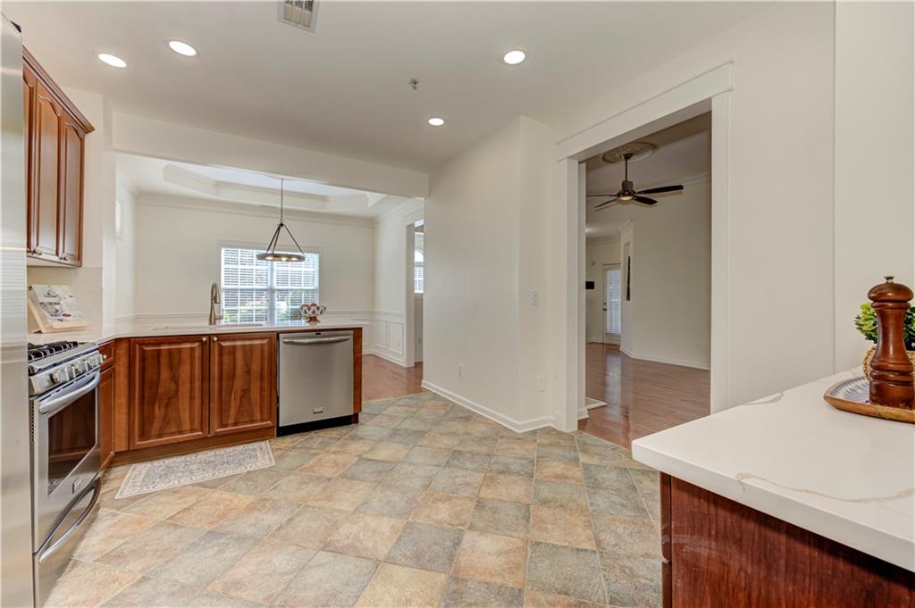 232 Glens Loop Woodstock, GA 30188 - Photo 28 of 52 a kitchen with stainless steel appliances a sink and a refrigerator