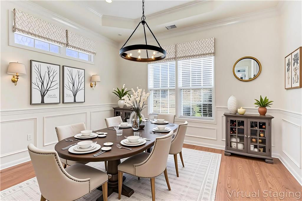 232 Glens Loop Woodstock, GA 30188 - Photo 29 of 52 a view of a dining room with furniture window and wooden floor