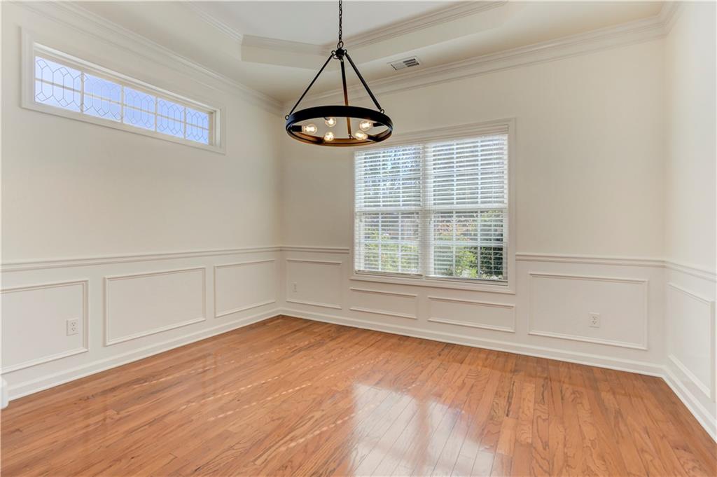 232 Glens Loop Woodstock, GA 30188 - Photo 30 of 52 a view of empty room with wooden floor and fan