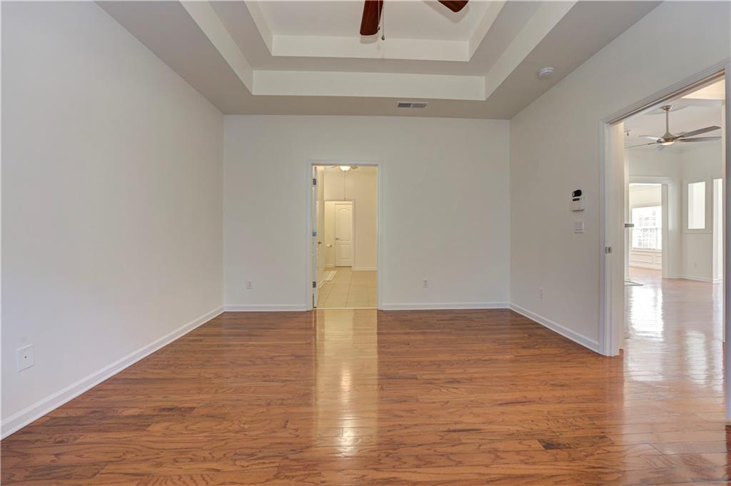 232 Glens Loop Woodstock, GA 30188 - Photo 37 of 52 a view of empty room with wooden floor