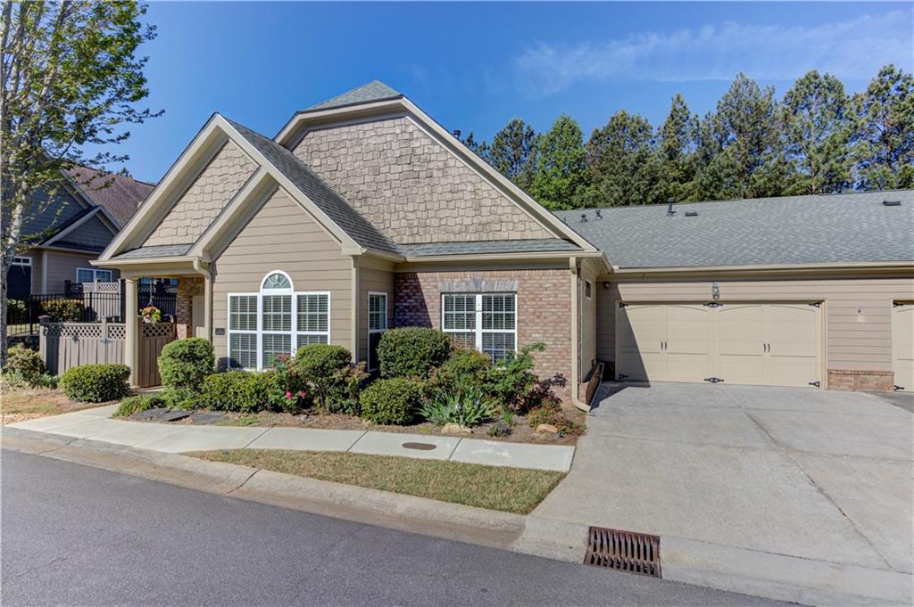 232 Glens Loop Woodstock, GA 30188 - Photo 4 of 52 a front view of a house with a yard