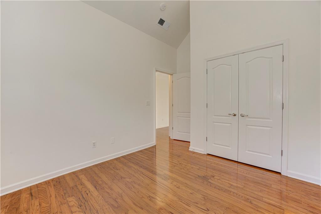 232 Glens Loop Woodstock, GA 30188 - Photo 45 of 52 a view of an empty room with wooden floor