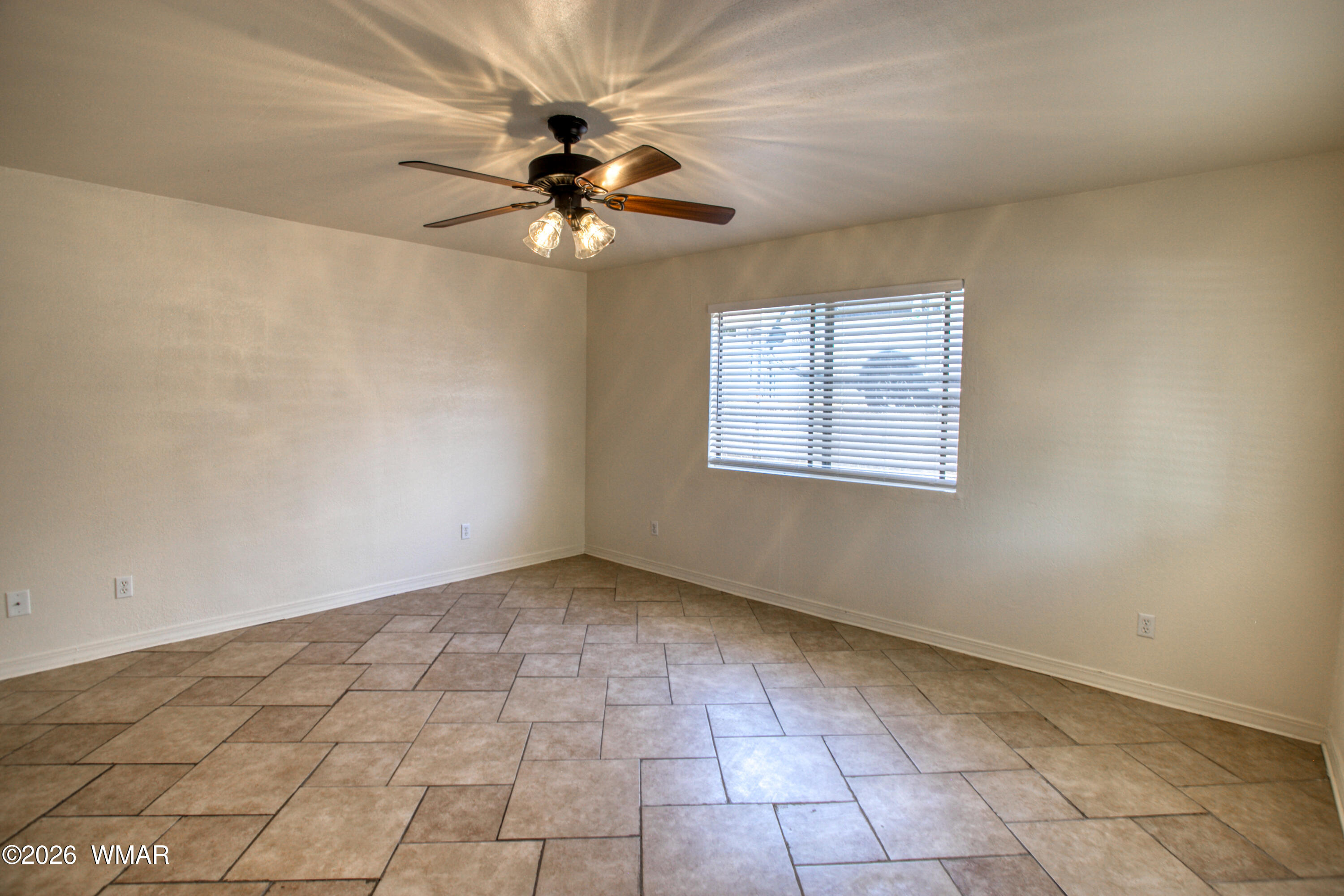 411 West Stratton Show Low, AZ 85901 - Photo 4 of 47 a view of an empty room with a window