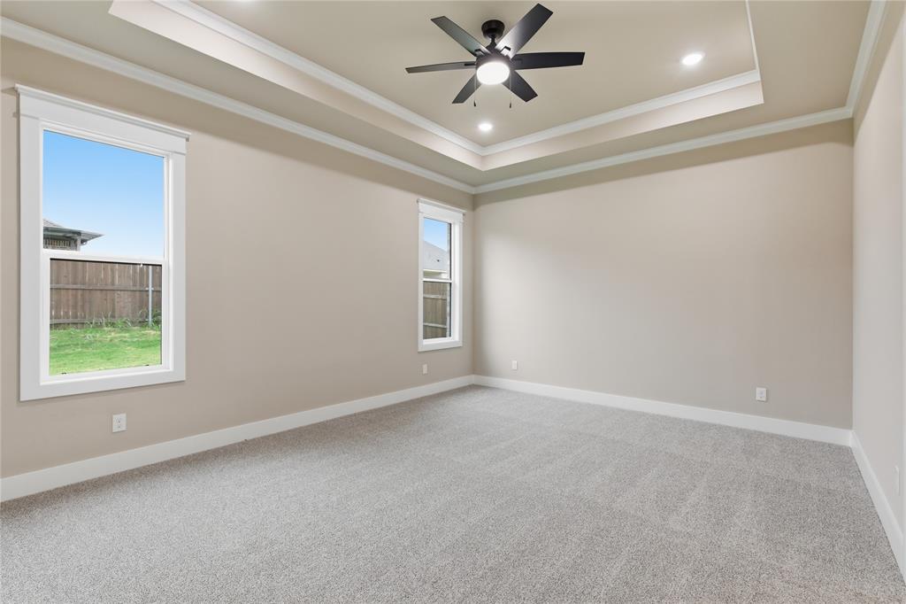 702 Anne Road Van Alstyne, TX 75495 - Photo 14 of 27 Spacious room featuring light gray carpeting and neutral wall tones