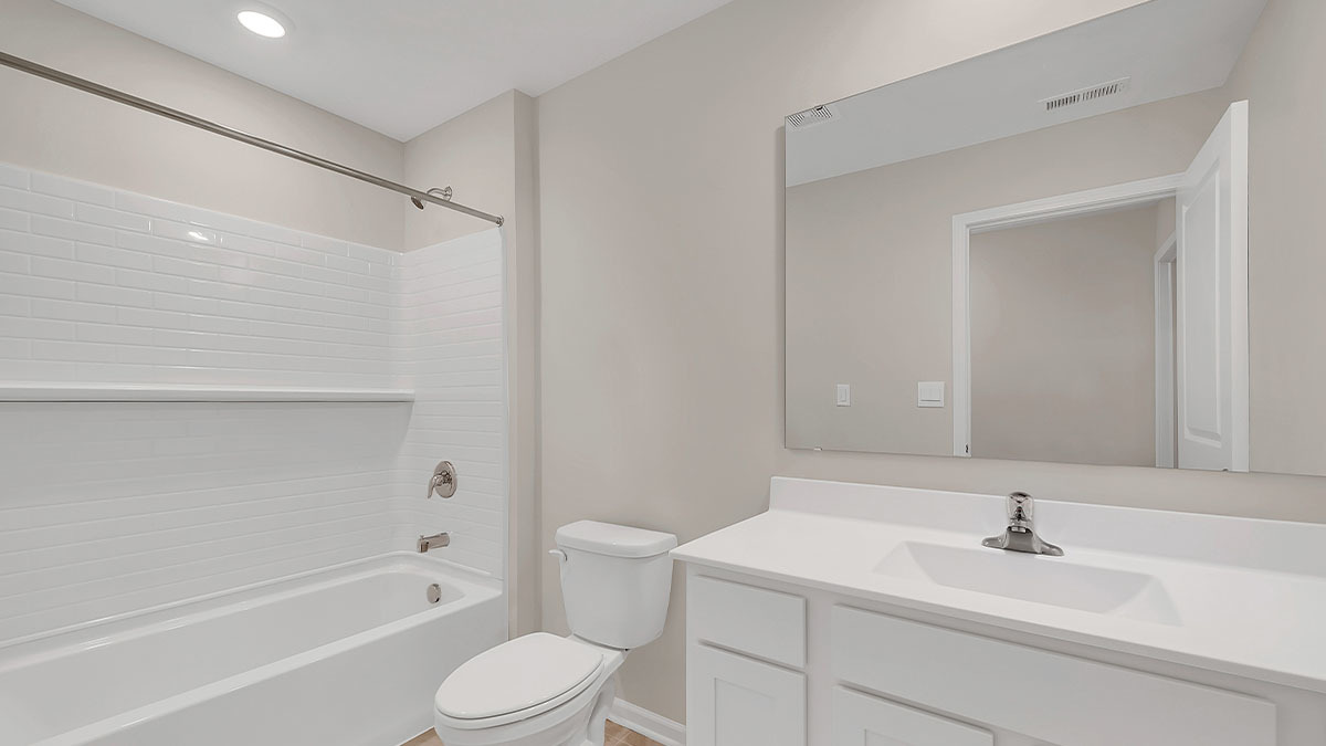 26110 South Castle Boulevard Manhattan, IL 60442 - Photo 15 of 30 a bathroom with a sink toilet and shower